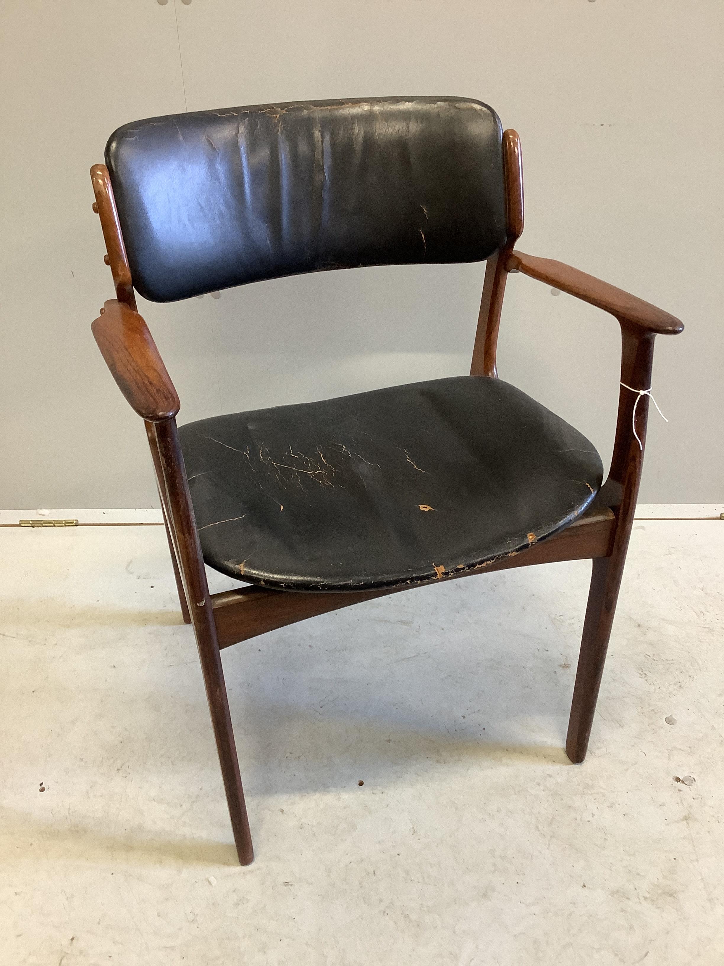 A mid century Danish design rosewood elbow chair, width 58cm, depth 42cm, height 80cm